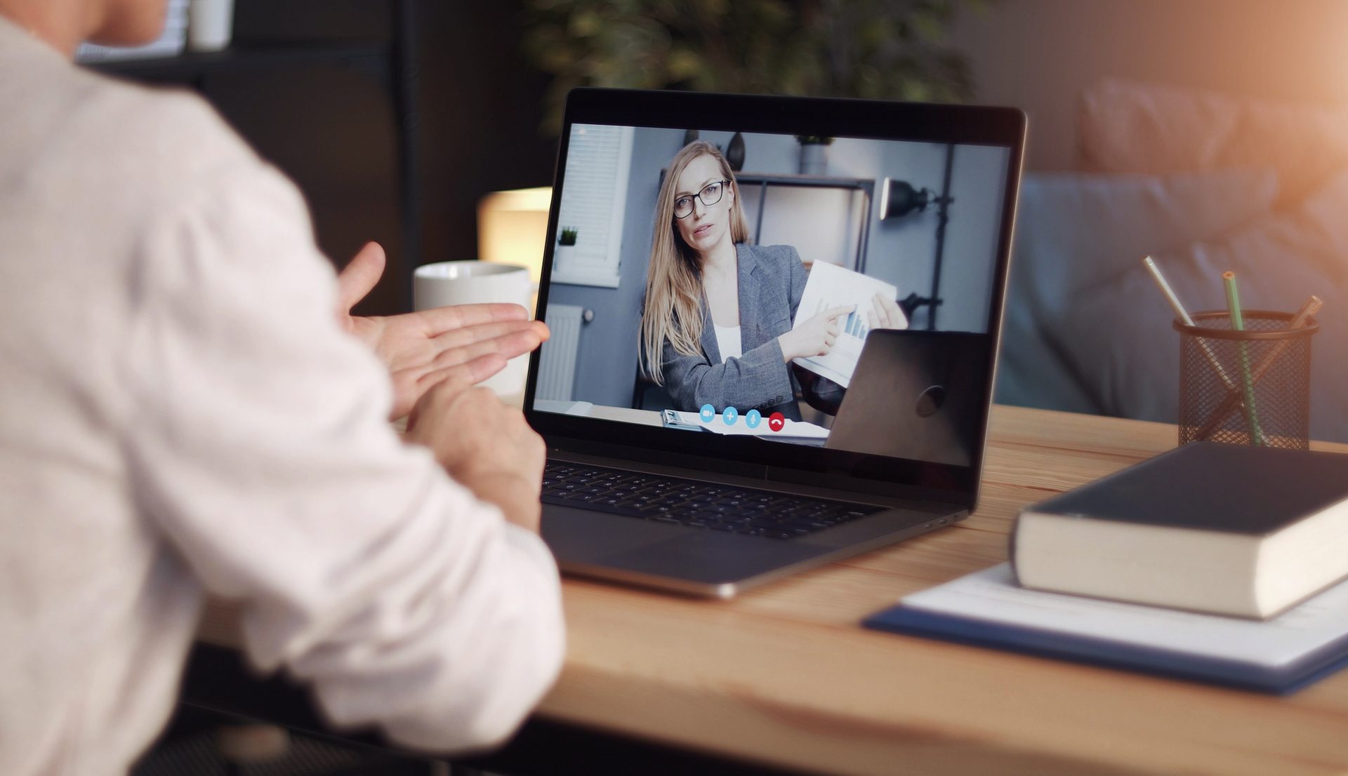 A client on a video call getting remote help on their laptop at home